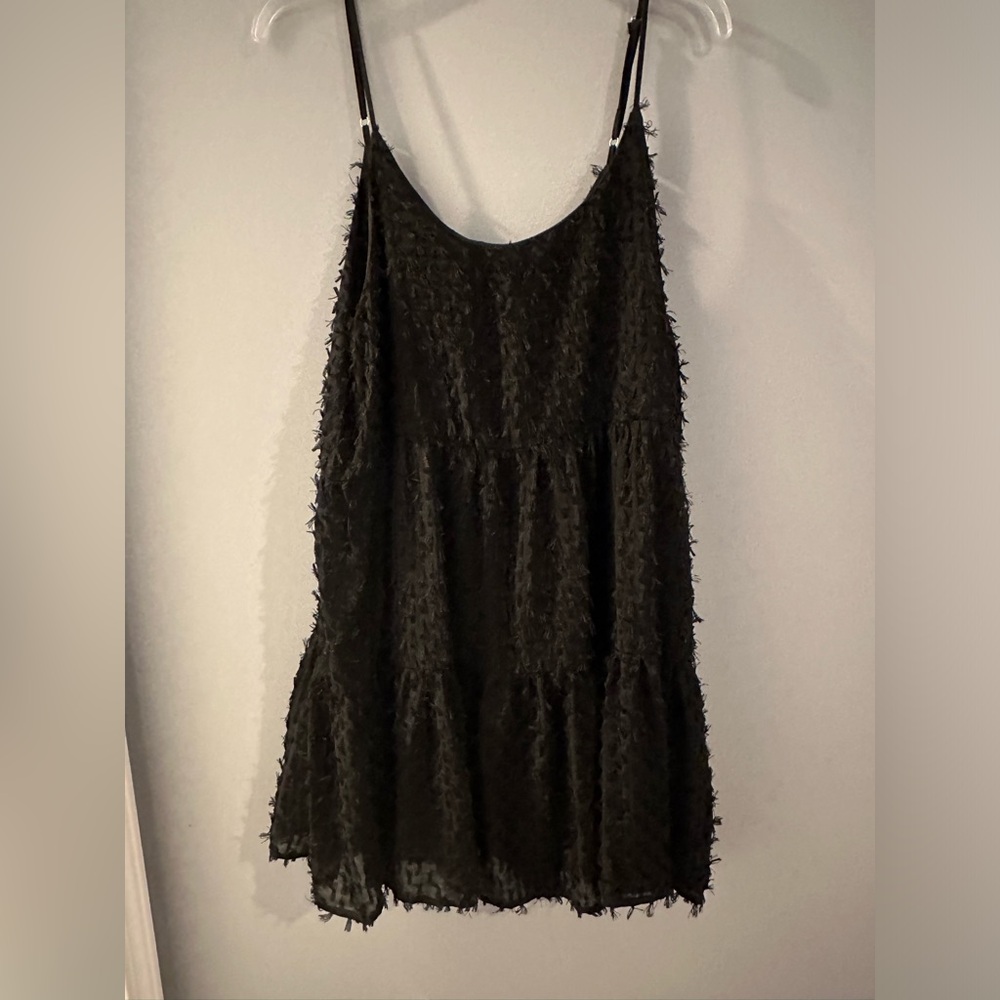 Used like new black mini dress, ties in the back!